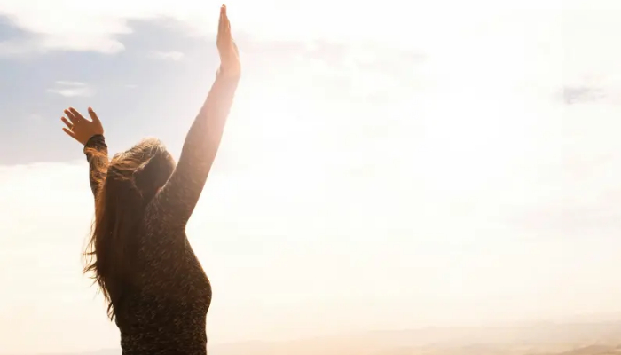 Woman in surrender to God